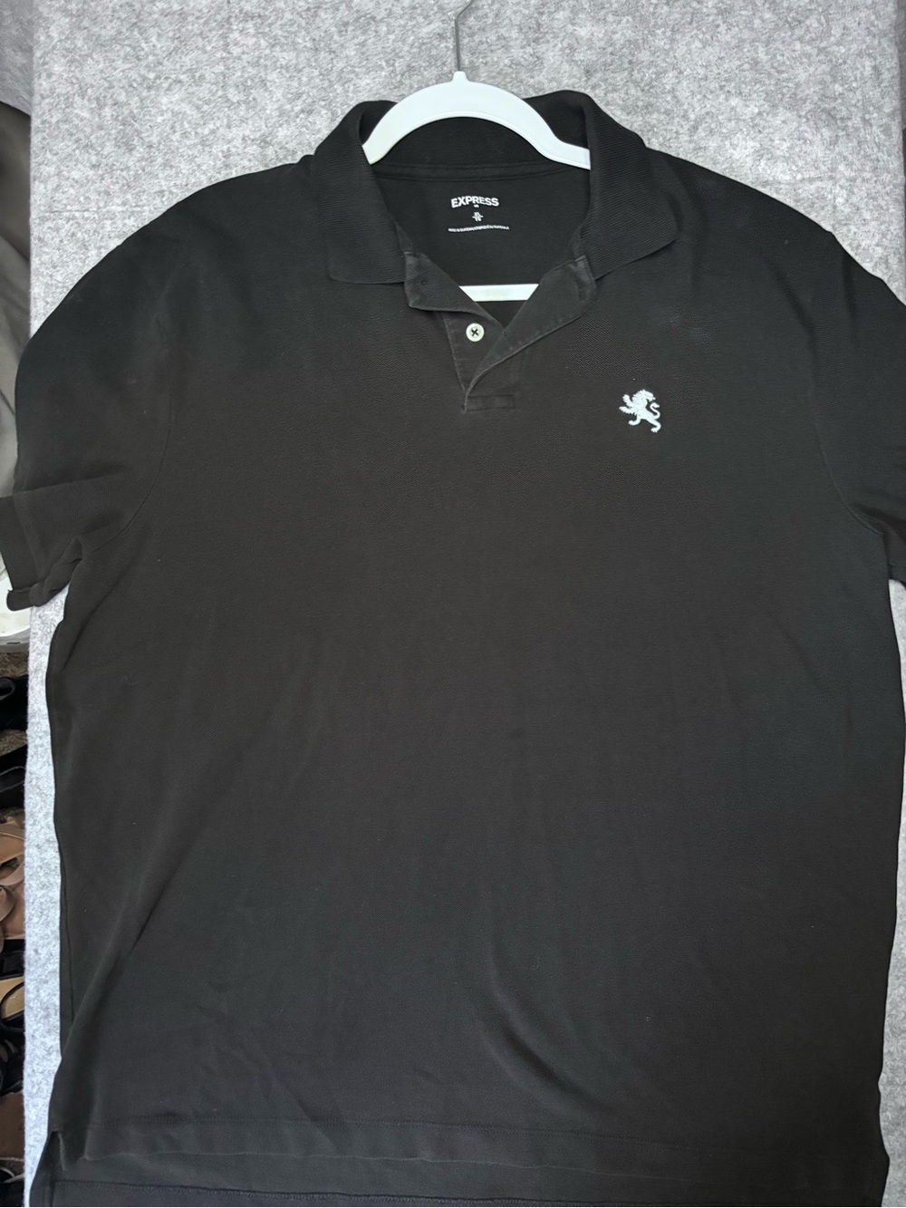 Express Black Polo with Small White Lion Emblem